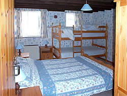 Stable bedroom with bunk beds and double bed