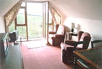 Lounge with balcony with countryside views